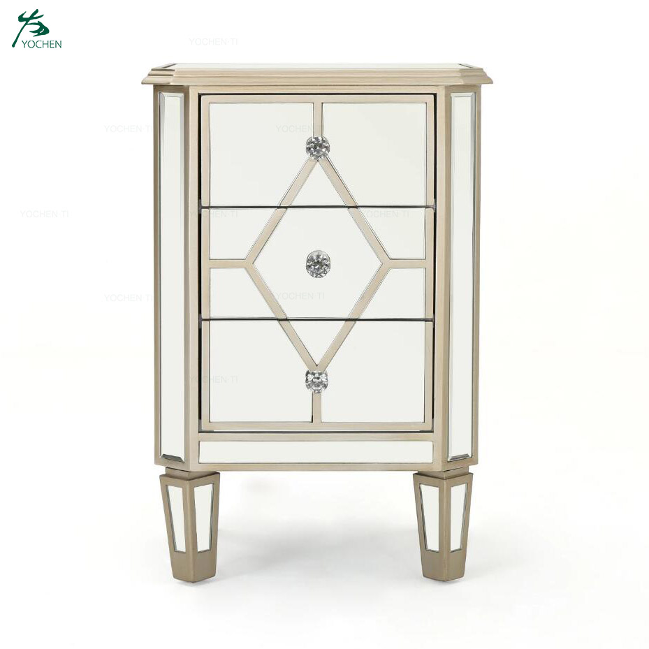 Silver finished mirrored 3 drawer cabinet with faux wood frame